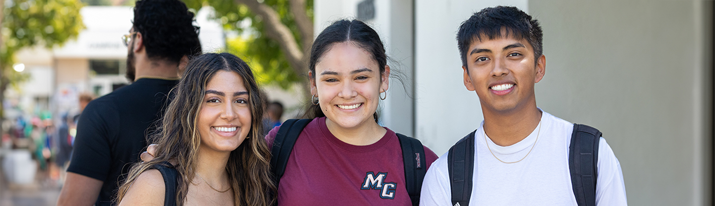 3 smiling students