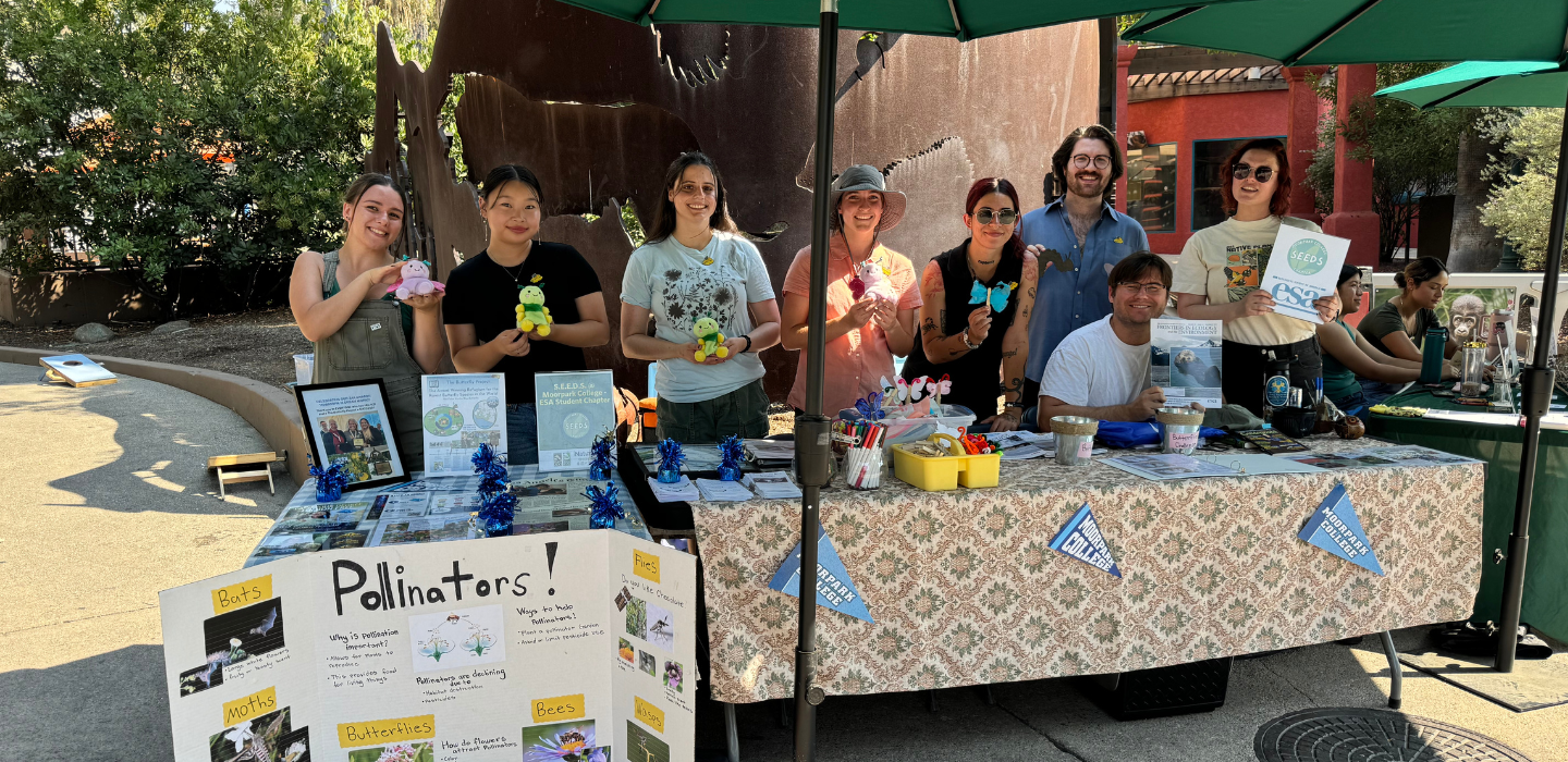 Members of the SEEDS Chapter at MC table at an outreach event at the LA Zoo.